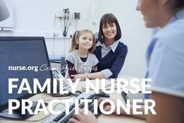 Family nurse practitioner taking notes on computer with mother and daughter in background
