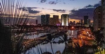 Sunset in Hawaii with city skyline of Honolulu