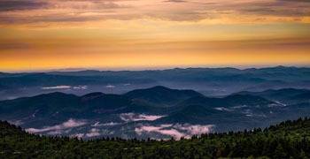 Sweeping view of multiple North Carolina cities from the mountains